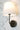 Emily Cordless Wall Sconce Black mounted on a modern wall