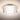 Belu Clear drum glowing on the ceiling, ribs catching the light | Besa Lighting