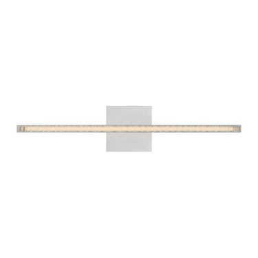 Contemporary wall light with raw cut crystal and polished nickel finish over bathroom mirror