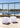 Two Smart & Green Dice cube lamps beside a pool with a railing
