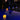 Smart & Green Flatball lamps glowing yellow in a blue-lit pool at night