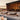 Smart & Green Globe lamp glowing warm beside poolside lounge chairs on a wooden deck