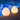 Two Smart & Green Rock lamps glowing warm white on a pool edge against blue tile