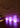 Smart & Green Tower cylinder lamps glowing purple and pink in a cluster