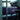 Oluce Spider floor lamp lighting a modern kitchen and dining area
