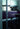 Oluce Spider floor lamp lighting a modern kitchen and dining area