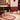 Spirit wool rug in Beige, styled in a room