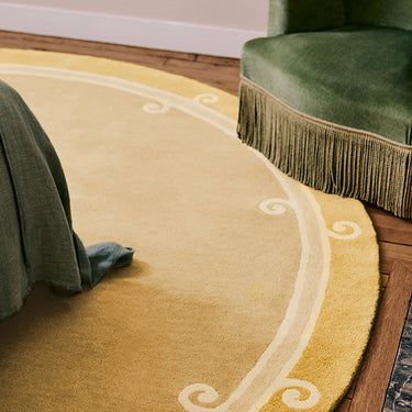 Syracuse Round wool rug in Yellow, styled in a room