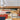 Artopia wool rug in Multi, styled in a room