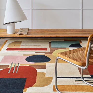 Artopia wool rug in Multi, styled in a room