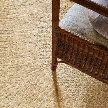 Eye Flower wool rug in Beige, styled in a room