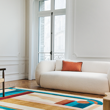 Hacienda wool rug in a room setting with colorful graphic pattern