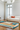 Hacienda wool rug in a room setting with colorful graphic pattern