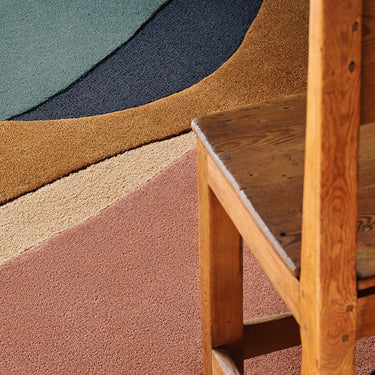 Océane wool rug, styled in a room