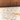 Paint wool rug in Ocre, close-up of the pile texture