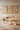 Alice wool rug in Beige, styled in a room