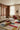 Artopia wool rug in Multi, styled in a room