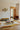 Facette wool rug in Ocre, styled in a room