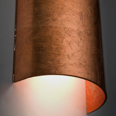 Torre 18 in Copper Foil glowing on a wall | Besa Lighting
