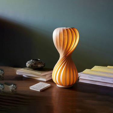 Lit on a desk with books | TR7 Table Lamp by Tom Rossau