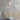 Graypants Wick S lifestyle, Mist Gray lamp on a wooden stump