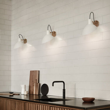 Astep VV Cinquanta Wall wall light, three white reflectors over a kitchen counter