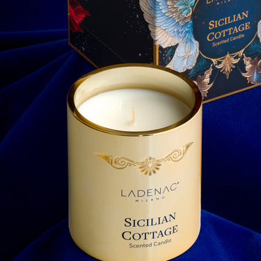 Ladenac Sicilian Cottage 330 g candle – candle styled against a deep blue backdrop