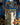 Ladenac Sicilian Cottage 75 g candle with carousel – candle styled against a deep blue backdrop