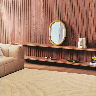Volute wool rug in Beige, styled in a room