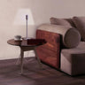 Innovative Yoy lamp illuminating a bedroom nightstand, creating a virtual lampshade silhouette for ambient light.