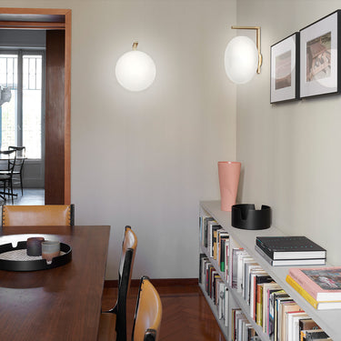 Modern designer Alba 174 wall lamp by Oluce, satin brass frame with diffused opaline glass glow