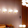 Alba 176 Wall Light by Oluce in satin brass with polished blown glass for modern bedrooms