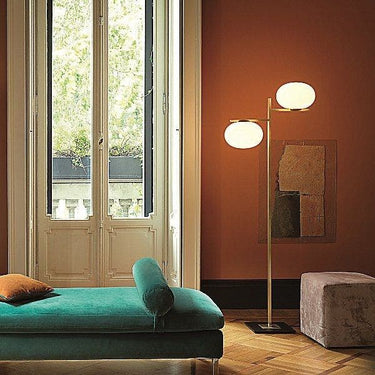 Designer Oluce Alba 383 floor lamp with soft diffused light, polished glass shade, and satin brass structure