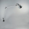 Tolomeo Classic adjustable aluminum wall lamp with articulated arm and rotatable shade by Artemide for task lighting