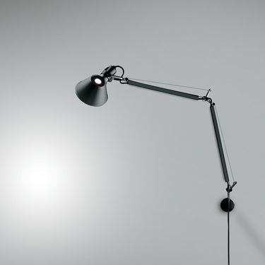 Adjustable Artemide Tolomeo Classic LED Wall Light illuminating a workspace