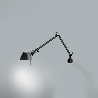 Tolomeo Mini black wall light by Artemide with flexible swing arm in modern minimalist interior wall mount