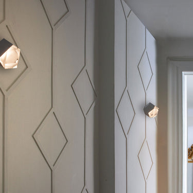 Contemporary geometric wall light Astro by Oluce for living room interiors