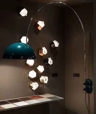 Modern Astro wall light by Oluce in black with direct and diffused illumination