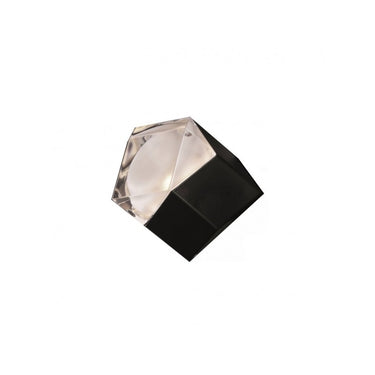 Sculptural Astro wall light creating prism effect on hallway walls