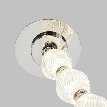 Surface mount driver installation for modern crystal chandelier, 3000K soft white lighting.
