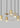 Eaves 18 light linear pendant, natural brass, close-up of domed LED optic, modern linear lighting detail.