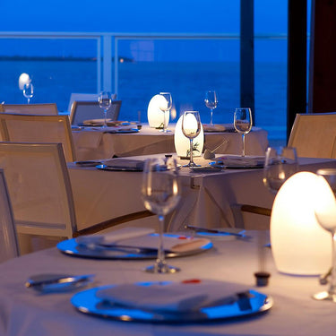 Wireless Neoz Egg table lamp, award-winning design, soft glow, perfect for restaurant and hotel use.