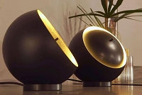Sculptural Eva table lamp with adjustable telescopic cover and warm 3000K LED light for contemporary living room
