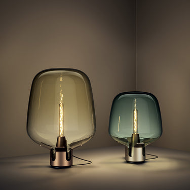 Lodes Flar sculptural glass lamp designed by Patrick Norguet in a contemporary bedroom.