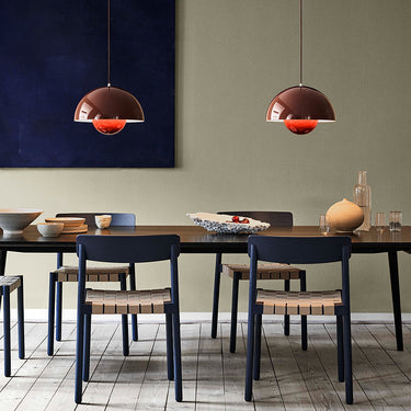 Verner Panton Flowerpot VP2 ceiling lamp hanging in a modern dining room
