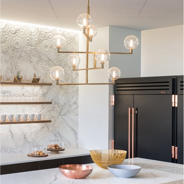 Aged Brass Gambit Chandelier, Visual Comfort Modern, Angled View of Glass and Metal, over kitchen island