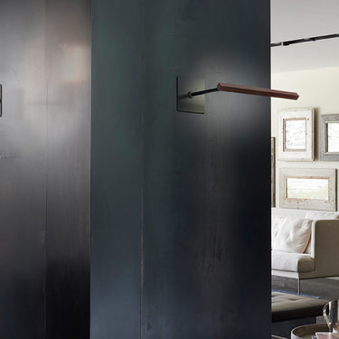 Contemporary Ilo wall light fixture by Oluce with satin bronze finish for living rooms