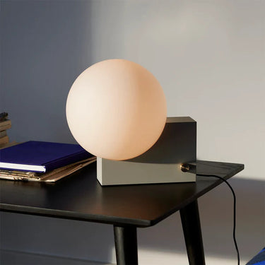 Designer Signe Hytte's Journey lamp by &Tradition shown in a stylish hotel lobby space. 