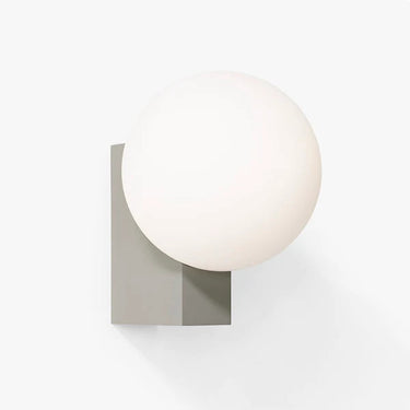 Journey SHY2 wall light by &Tradition in silk grey finish mounted beside a contemporary bed