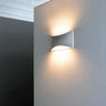 Minimalist up and down wall lamp Kelly 790 by Oluce for hotel interiors